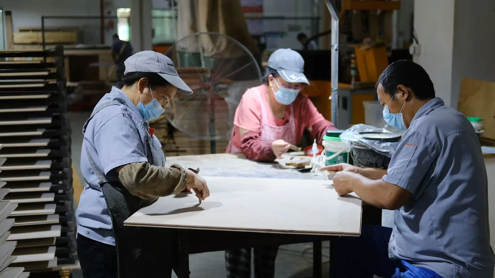 Anrantabu craftsmen hand-assembling inlay flooring pieces