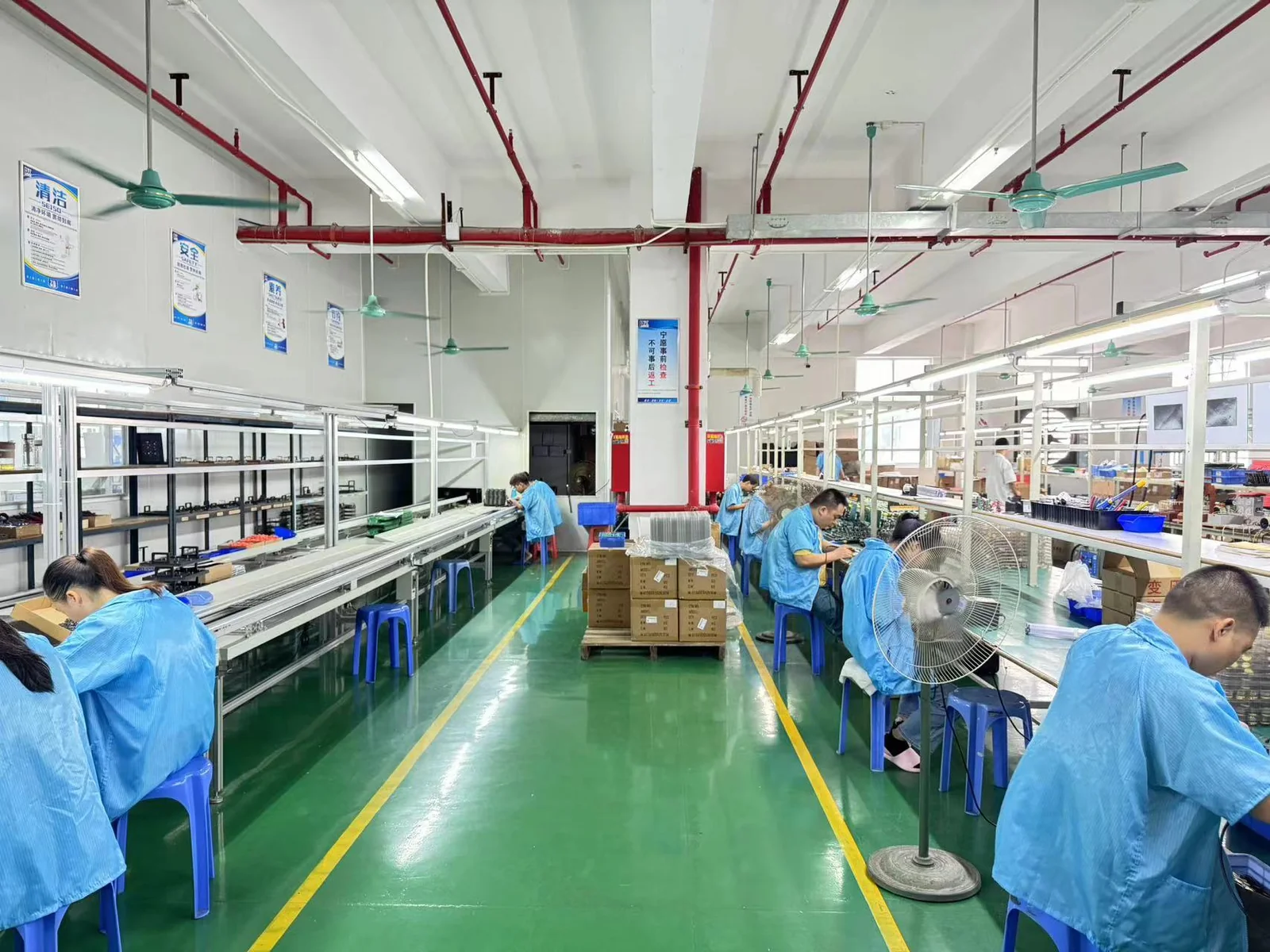 Pengxin Electronics SMT & DIP production line — workers at assembly stations