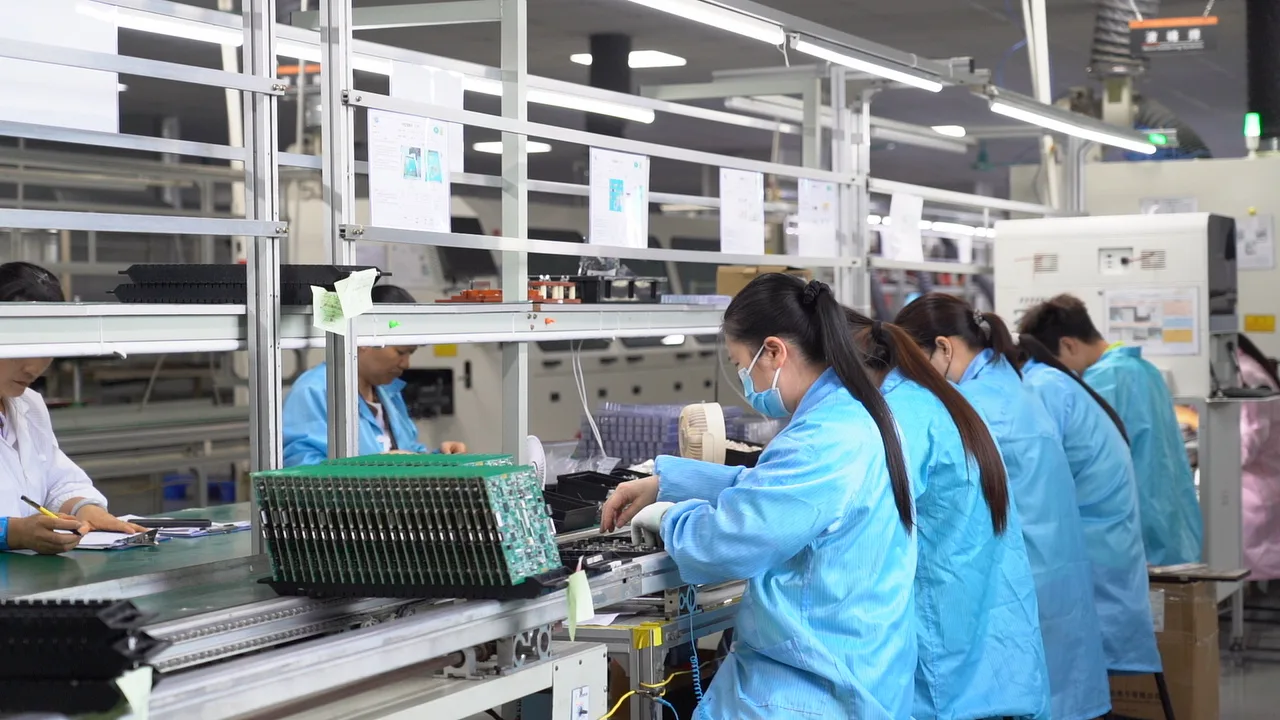 Shenpuneng Electronics production floor · Assembly & Test Stations